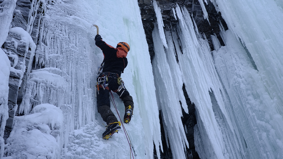 Ice climber on lead, Bong bong pillar in Abisko canyon